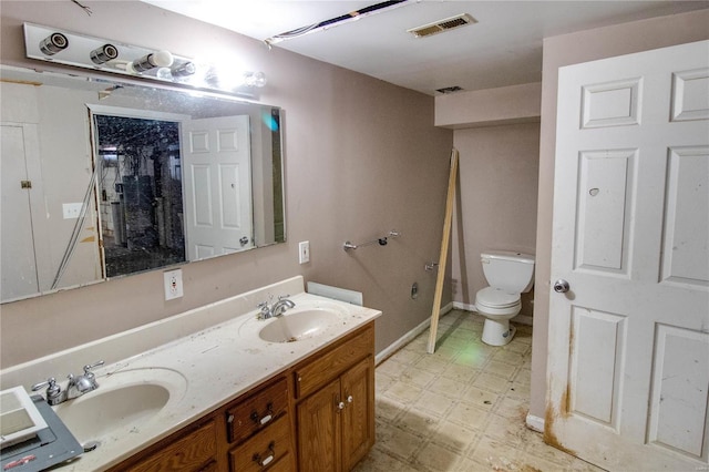 full bath featuring toilet, visible vents, a sink, and tile patterned floors