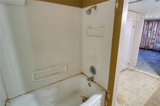 bathroom featuring a combined bath / shower with jetted tub and tile patterned floors