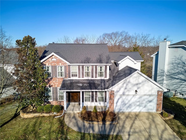 view of front of home featuring driveway, a shingled roof, an attached garage, and brick siding