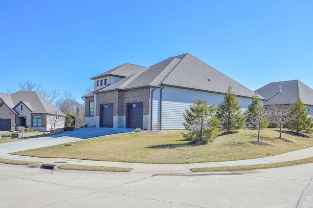 view of front of home featuring driveway, stone siding, and a front yard