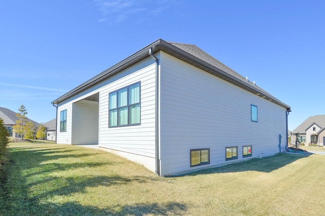 view of home's exterior featuring a lawn