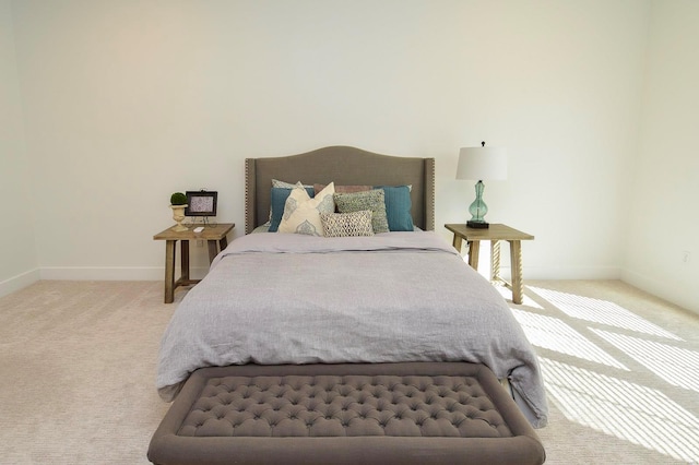 bedroom featuring carpet flooring and baseboards