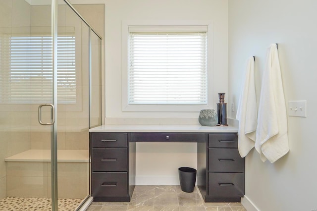 bathroom featuring a shower stall