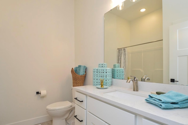 full bath featuring curtained shower, baseboards, vanity, and toilet