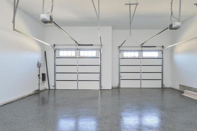 garage featuring baseboards and a garage door opener