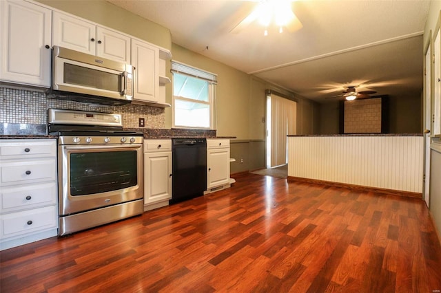 kitchen featuring decorative backsplash, white cabinetry, stainless steel appliances, and dark wood-type flooring