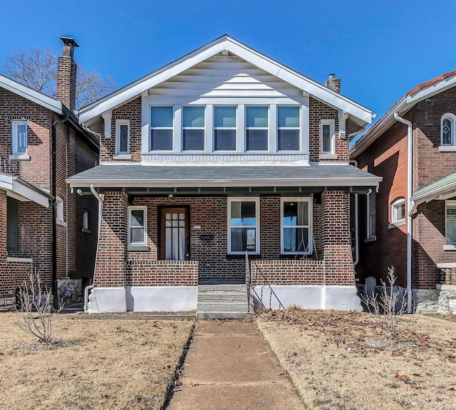 view of front of property with brick siding and a porch