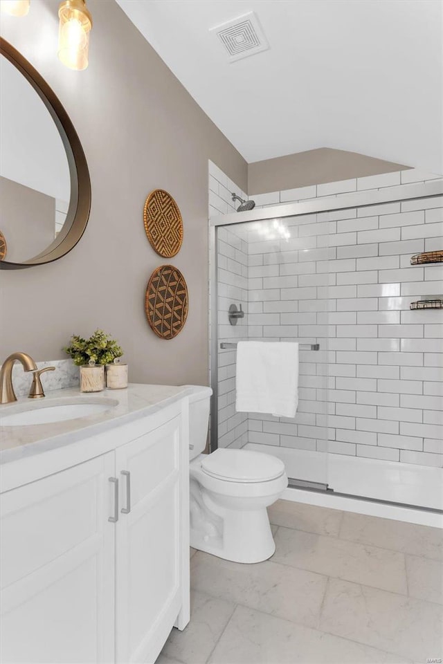 bathroom with visible vents, marble finish floor, a stall shower, and vanity