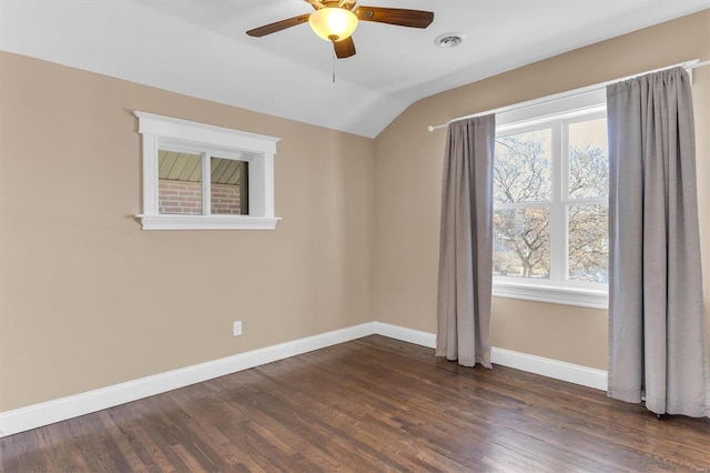 unfurnished room featuring a ceiling fan, visible vents, baseboards, lofted ceiling, and dark wood-type flooring