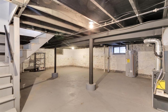 basement with stairway and electric water heater