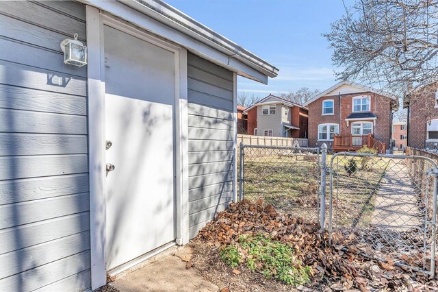 view of outbuilding with fence and a residential view