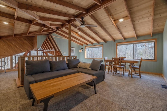 living area with lofted ceiling with beams, visible vents, carpet, and wood ceiling