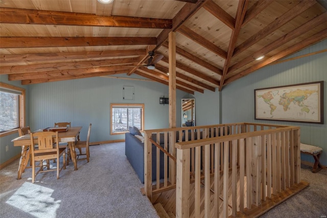 interior space with carpet flooring and vaulted ceiling