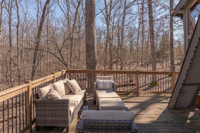 wooden terrace with an outdoor hangout area