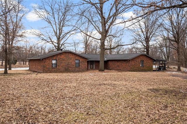 view of side of home with brick siding