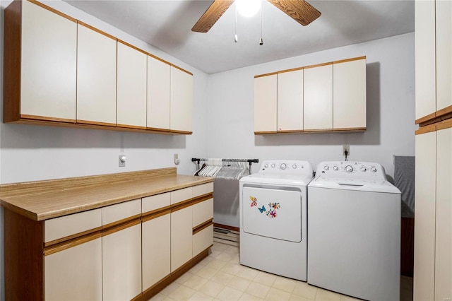 clothes washing area featuring cabinet space, ceiling fan, and separate washer and dryer