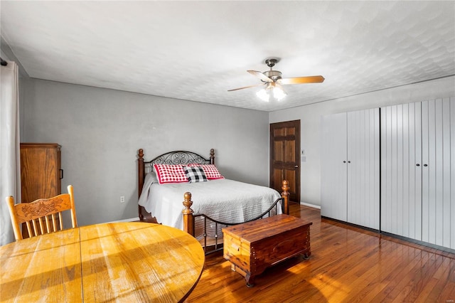 bedroom featuring hardwood / wood-style flooring and ceiling fan