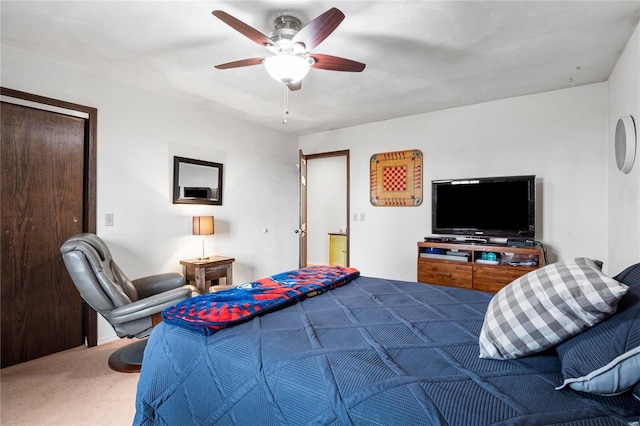 carpeted bedroom with a ceiling fan