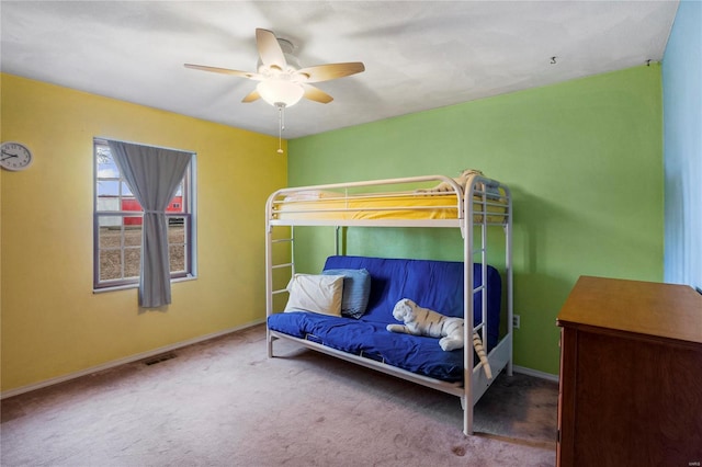 bedroom with carpet, visible vents, ceiling fan, and baseboards