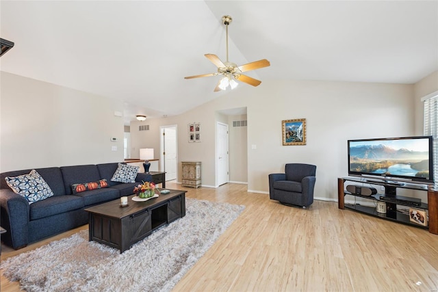 living room featuring lofted ceiling, visible vents, ceiling fan, wood finished floors, and baseboards