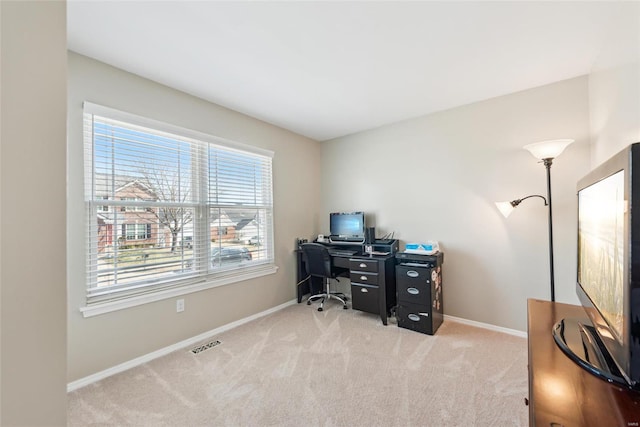 office with carpet, visible vents, and baseboards