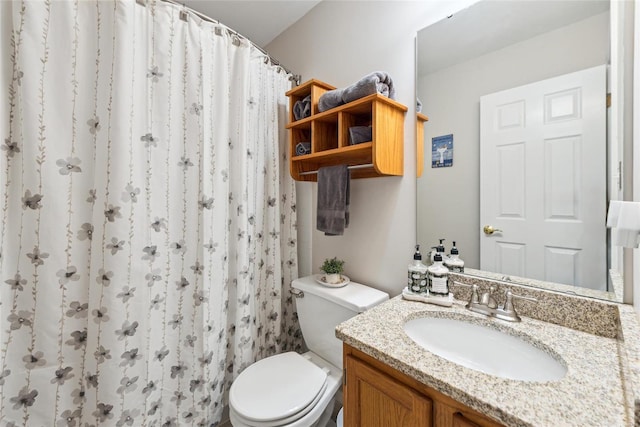 bathroom with vanity, toilet, and a shower with curtain