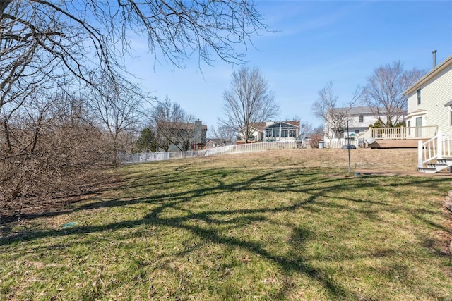 view of yard featuring a deck and fence