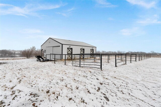 view of outdoor structure featuring an outbuilding, a rural view, and an exterior structure