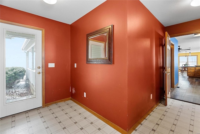 interior space with light floors and baseboards