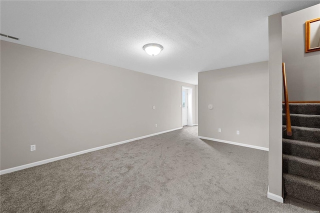 empty room featuring visible vents, stairs, baseboards, and carpet floors