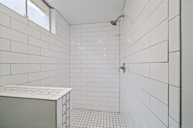 bathroom featuring tiled shower