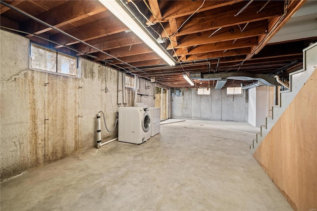 basement featuring washing machine and clothes dryer