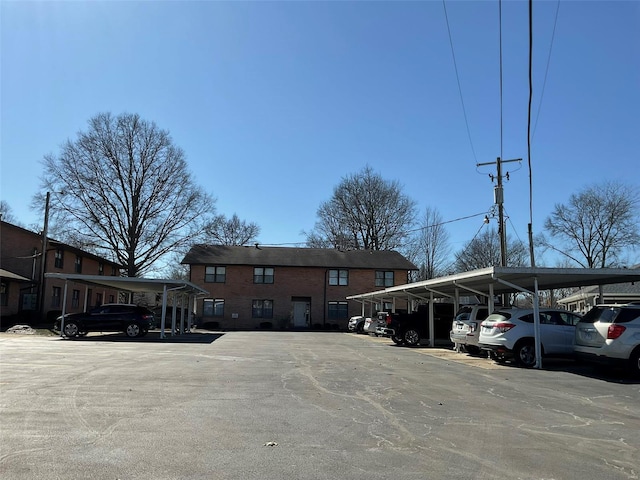 view of partially covered parking lot