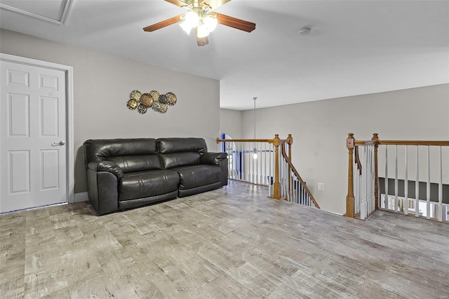 living area featuring ceiling fan and wood finished floors