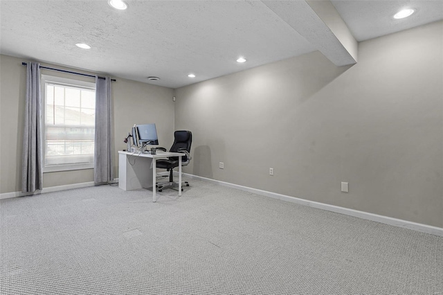 office area featuring a textured ceiling, recessed lighting, carpet flooring, and baseboards