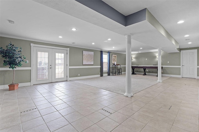 interior space with baseboards, french doors, and ornate columns