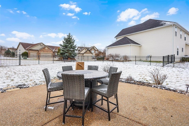 view of patio featuring a fenced backyard, a residential view, and outdoor dining space