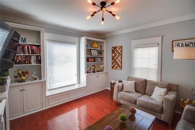 living area with crown molding and wood finished floors