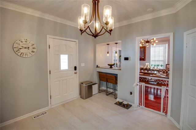 entrance foyer featuring baseboards, visible vents, crown molding, and wood finished floors