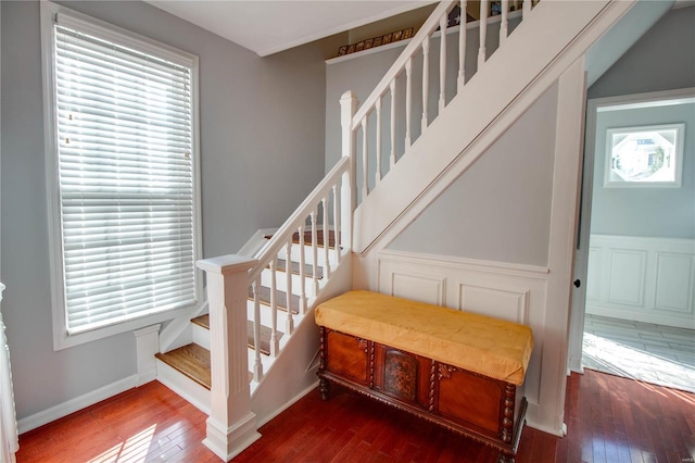 staircase with hardwood / wood-style flooring and baseboards