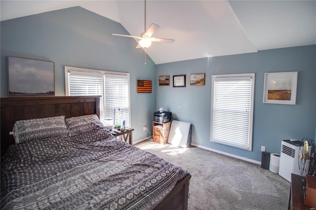 carpeted bedroom with lofted ceiling, ceiling fan, multiple windows, and baseboards