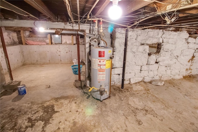 unfinished basement featuring water heater