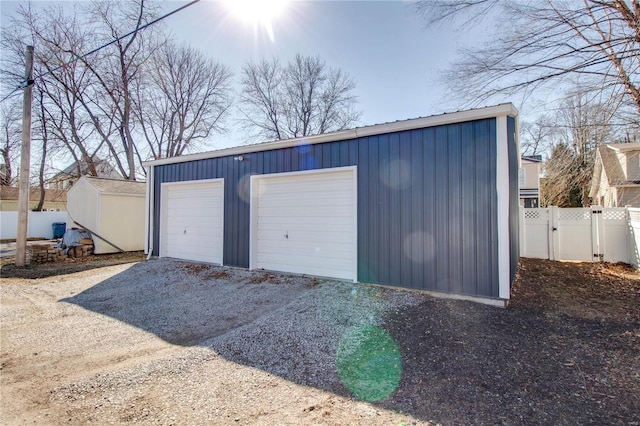 detached garage with fence