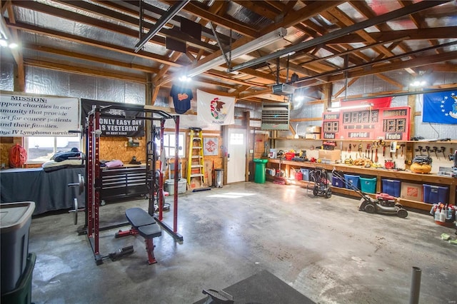 garage featuring a workshop area and a garage door opener