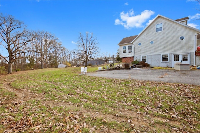 view of side of home featuring a yard