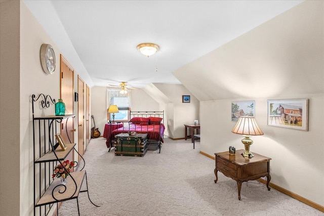 bedroom featuring vaulted ceiling, carpet, and baseboards