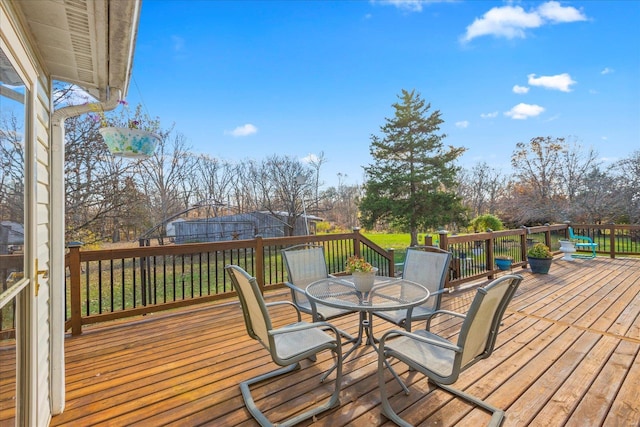 deck featuring outdoor dining space