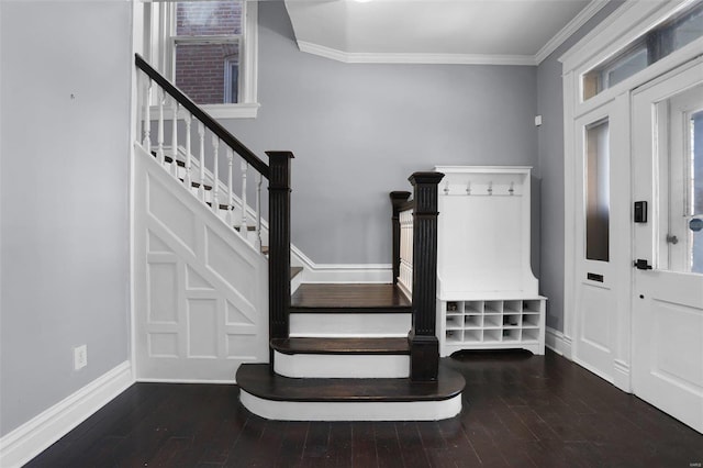 entryway featuring stairs, ornamental molding, wood-type flooring, and baseboards