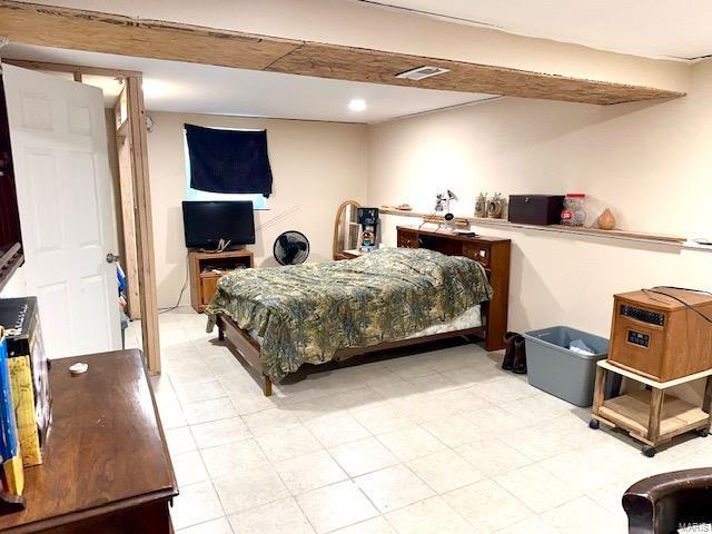 bedroom featuring visible vents