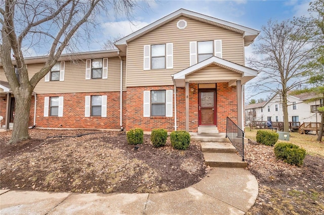 view of front of house featuring brick siding